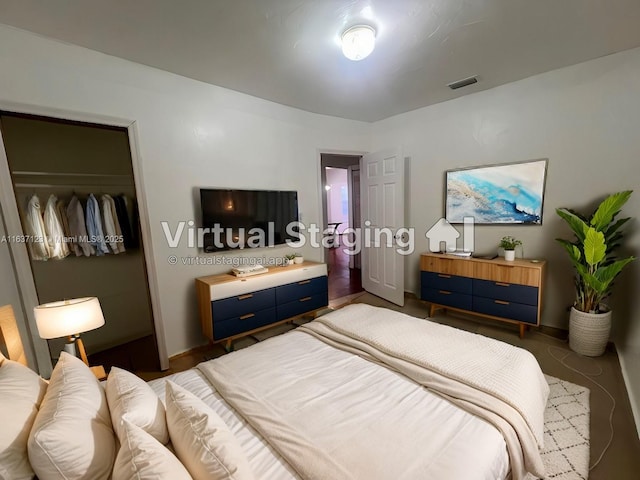 bedroom featuring a closet and visible vents