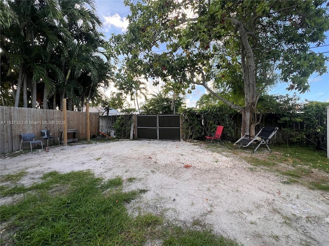 view of yard featuring a gate and fence