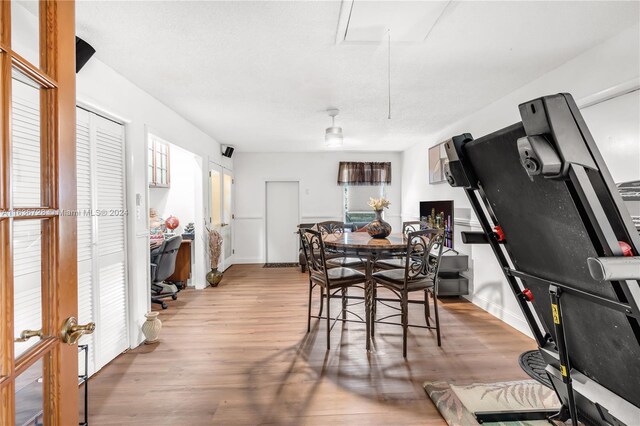 dining space with light hardwood / wood-style floors