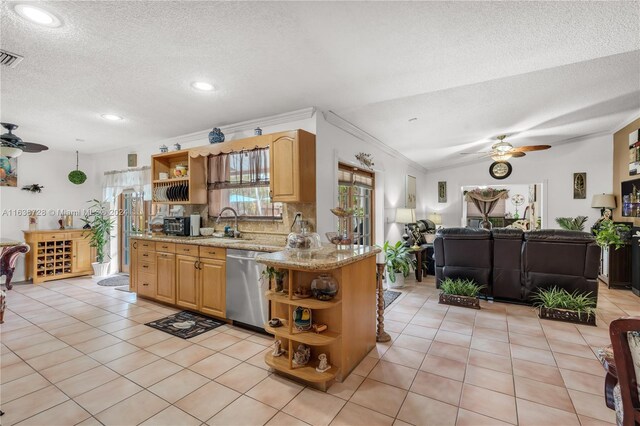 kitchen featuring ceiling fan, stainless steel dishwasher, light tile patterned floors, and tasteful backsplash