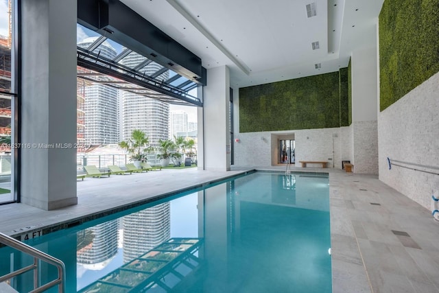 view of pool featuring a skylight