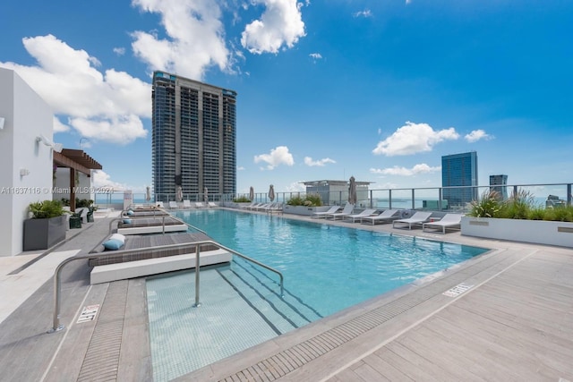 view of swimming pool featuring a patio area