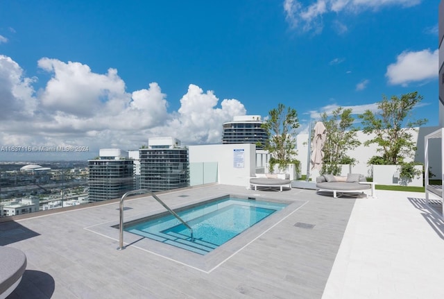 view of pool with a community hot tub