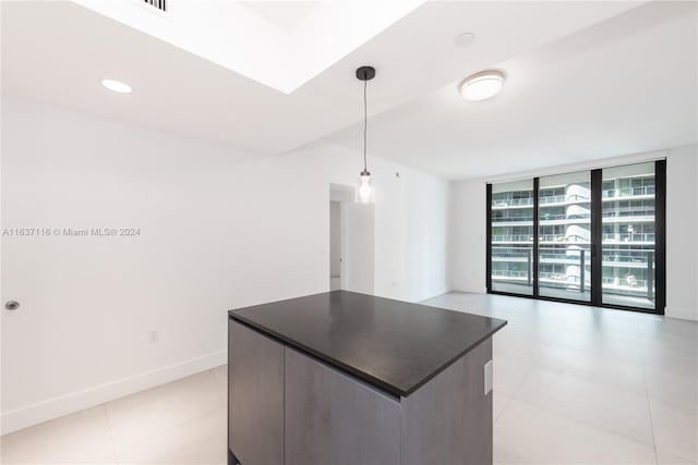 kitchen with pendant lighting and a wall of windows