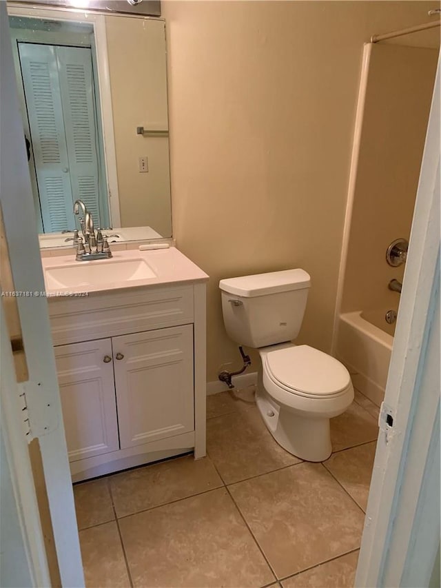 full bathroom featuring tile patterned flooring, bathtub / shower combination, toilet, and vanity