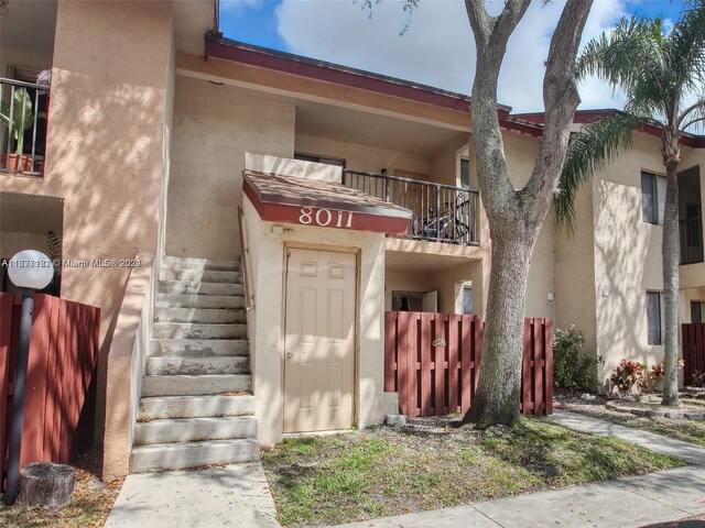 view of front of property with a balcony