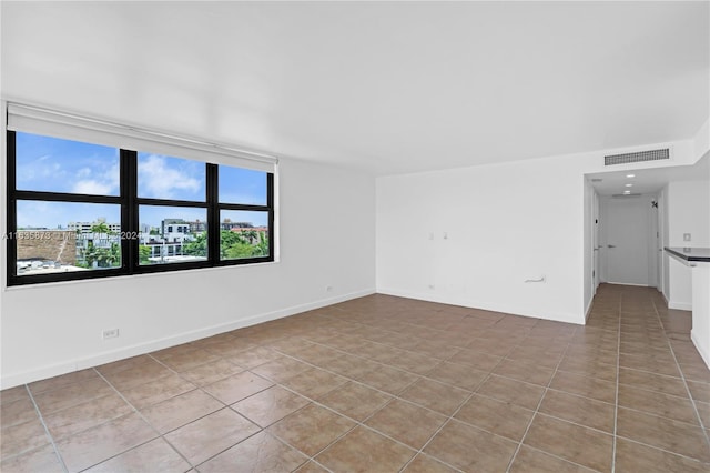 empty room featuring light tile patterned floors