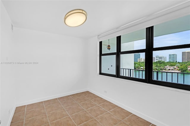 empty room with tile patterned flooring