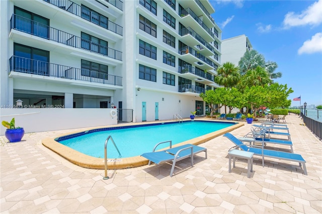 view of swimming pool with cooling unit