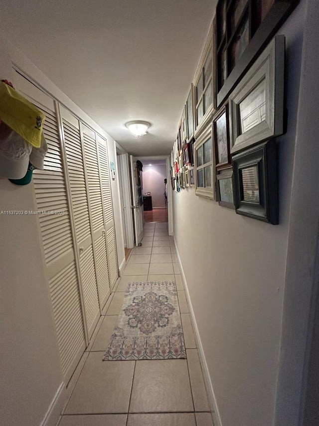 hallway featuring light tile patterned floors