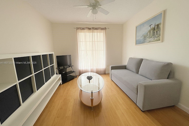 13781 SW 66th St Unit 221B, Miami, FL 33183 - living room featuring wood finished floors, a ceiling fan, and a textured ceiling