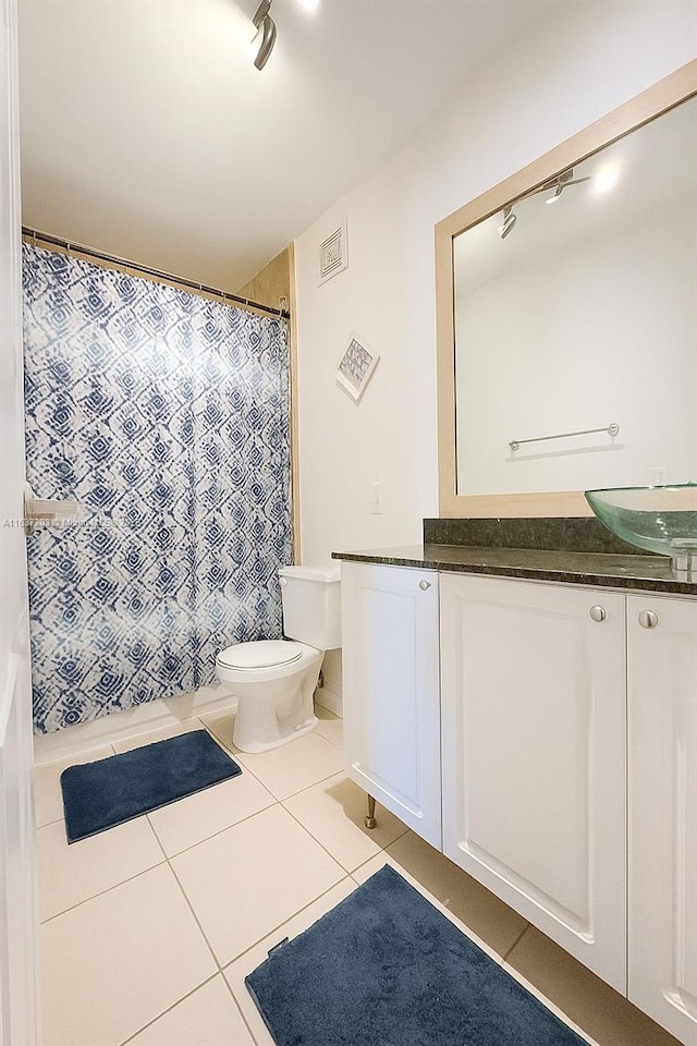 13781 SW 66th St Unit 221B, Miami, FL 33183 - bathroom with vanity, tile patterned flooring, rail lighting, and a shower with curtain
