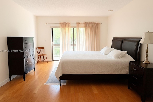 13781 SW 66th St Unit 221B, Miami, FL 33183 - bedroom with access to exterior and light wood finished floors