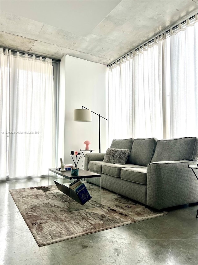 living room featuring concrete flooring