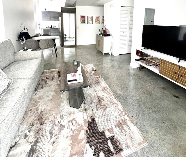 living room featuring concrete floors