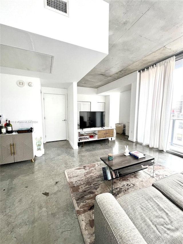 living room featuring concrete floors