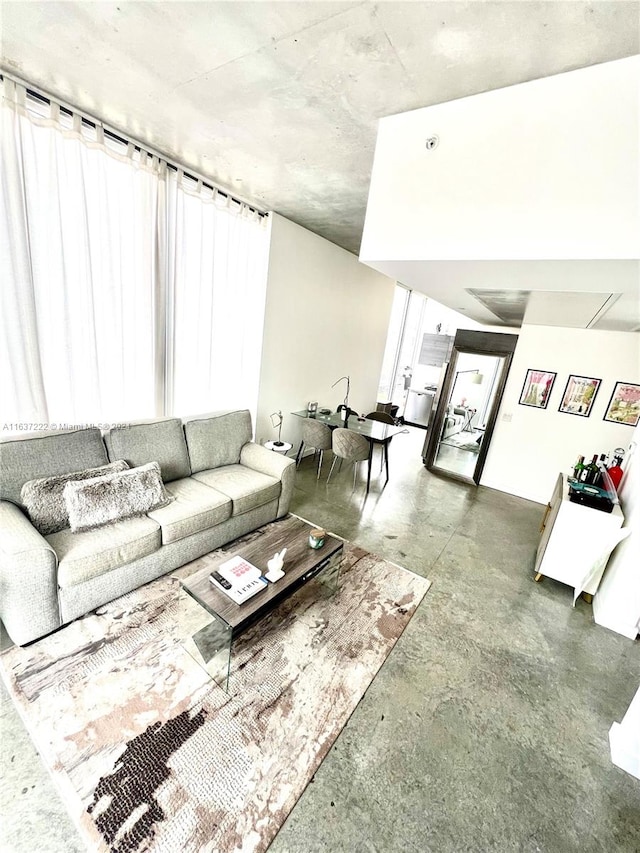 living room with concrete floors