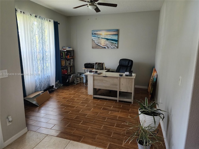 tiled office with a wealth of natural light and ceiling fan