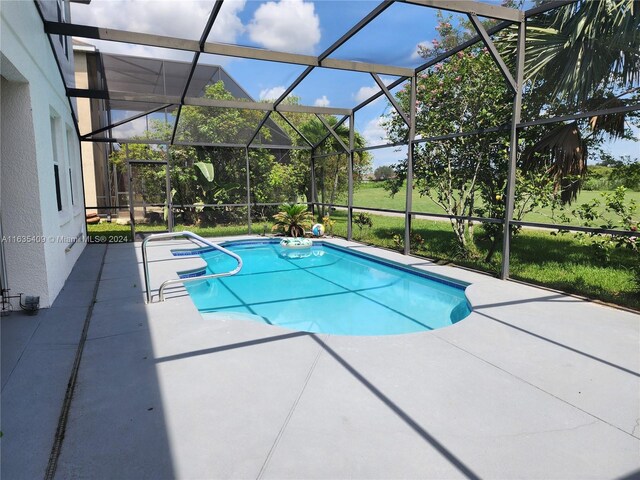 view of pool featuring a patio