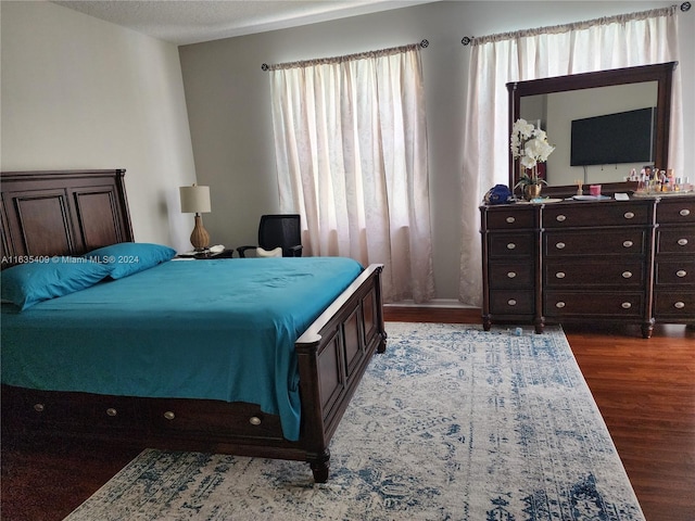 bedroom with hardwood / wood-style flooring