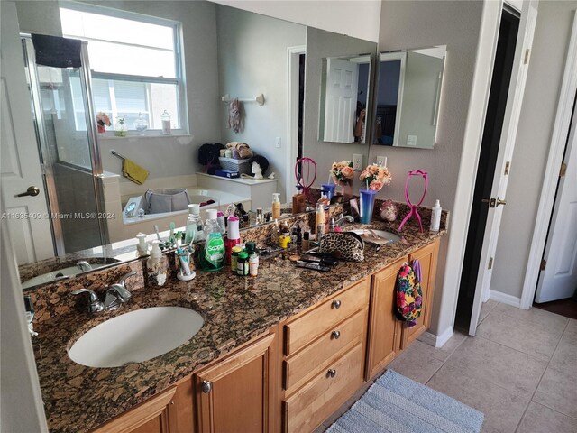 bathroom with tile patterned flooring and vanity