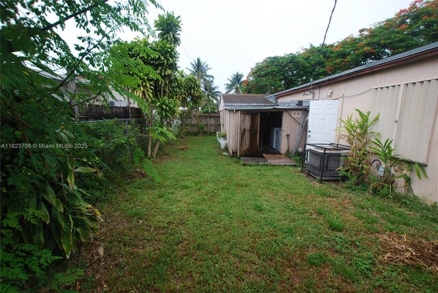 view of yard featuring central air condition unit