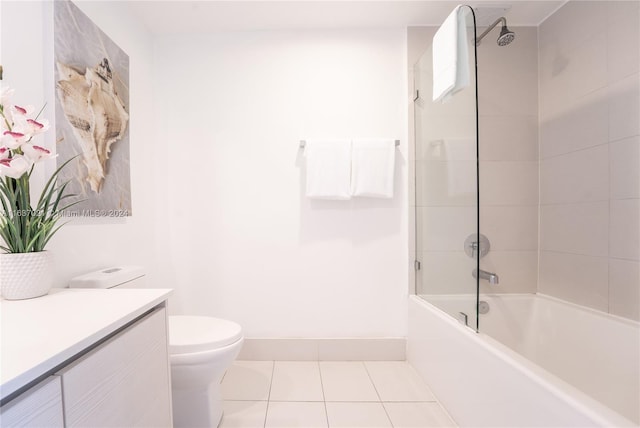 full bathroom with tile patterned flooring, toilet, vanity, and tiled shower / bath