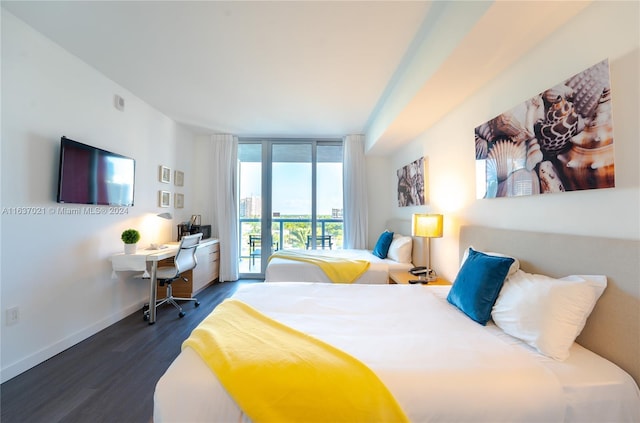 bedroom with access to outside, hardwood / wood-style floors, and floor to ceiling windows