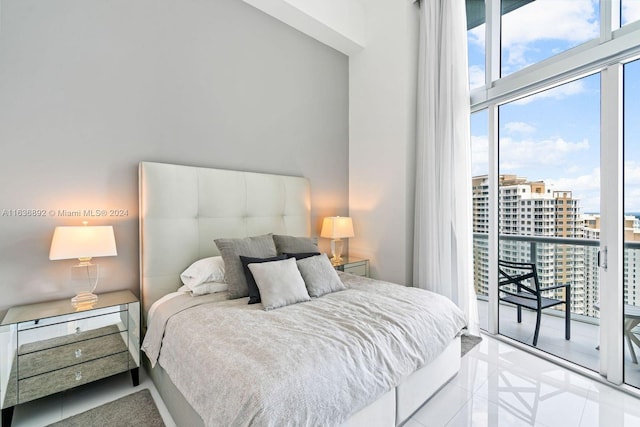 tiled bedroom featuring access to outside