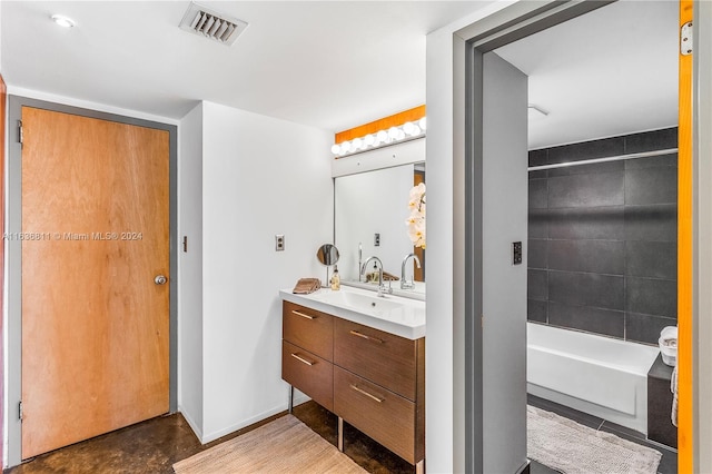 bathroom with bathing tub / shower combination and vanity