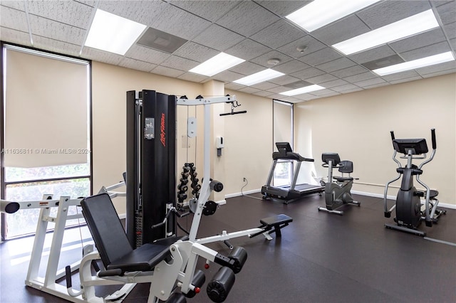 workout area featuring a drop ceiling