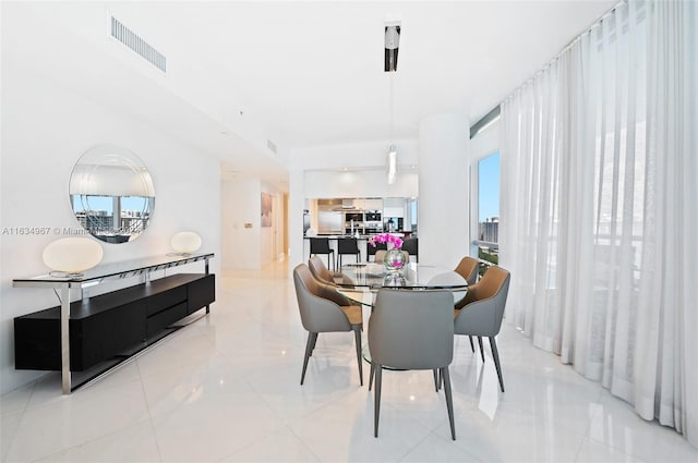 dining space featuring visible vents