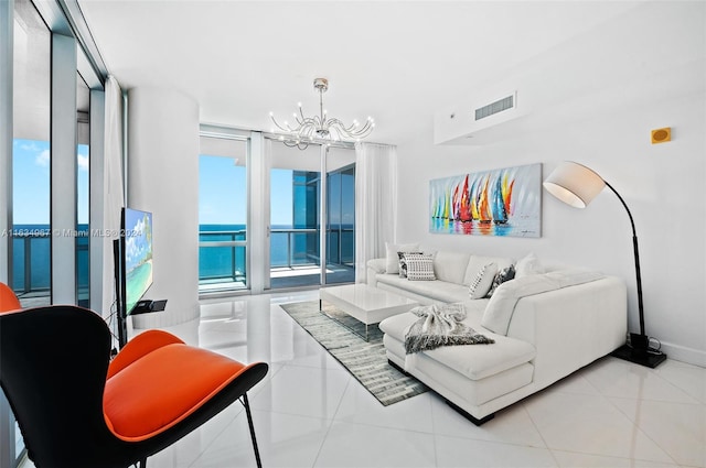 tiled living room featuring a chandelier and visible vents