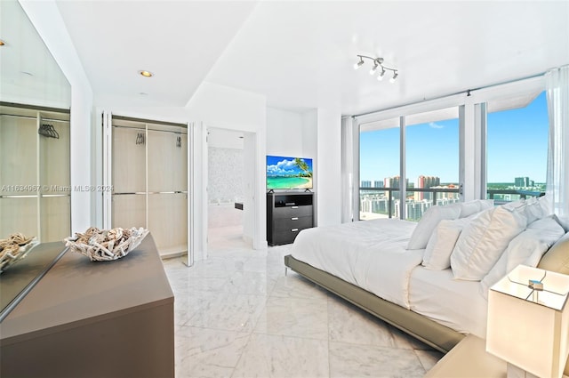 tiled bedroom with rail lighting