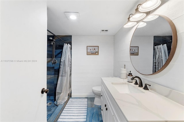 bathroom with vanity, a shower with curtain, and toilet