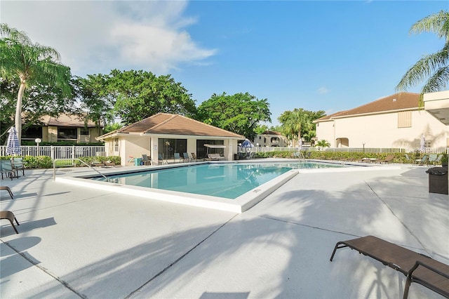 view of swimming pool featuring a patio