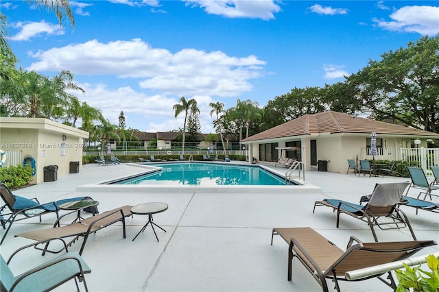 view of swimming pool with a patio