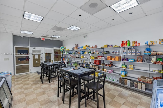 dining area with a drop ceiling