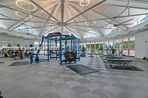 exercise room with an inviting chandelier