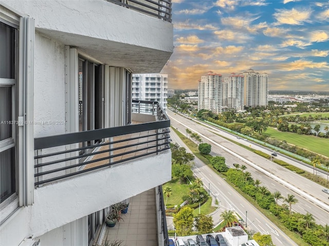 view of balcony at dusk