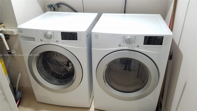 laundry area with separate washer and dryer