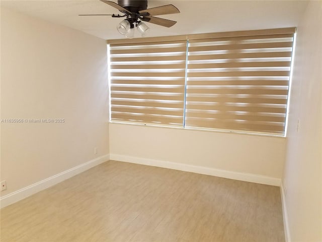 unfurnished room featuring ceiling fan and hardwood / wood-style floors