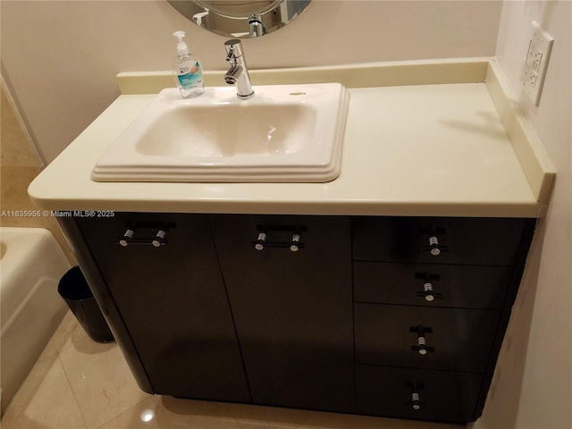 bathroom featuring sink and tile patterned flooring