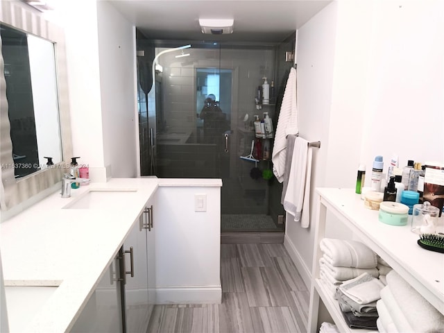 bathroom with vanity, walk in shower, and tile patterned floors