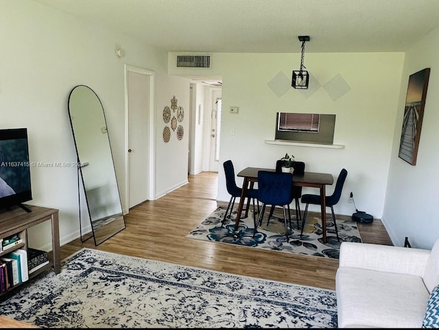 dining room with hardwood / wood-style flooring