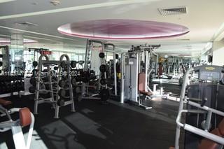 workout area featuring a raised ceiling