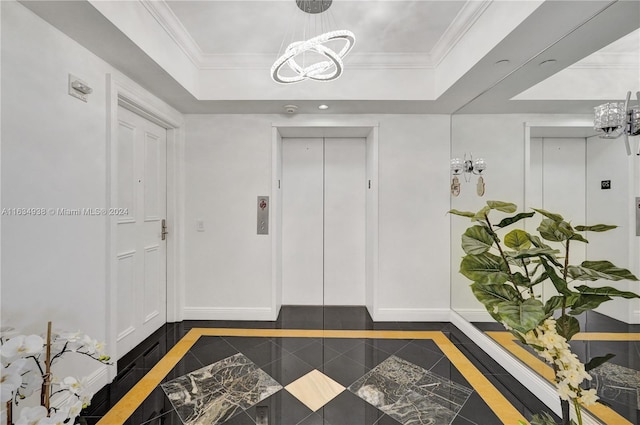 interior space with tile patterned floors, ornamental molding, elevator, and a tray ceiling