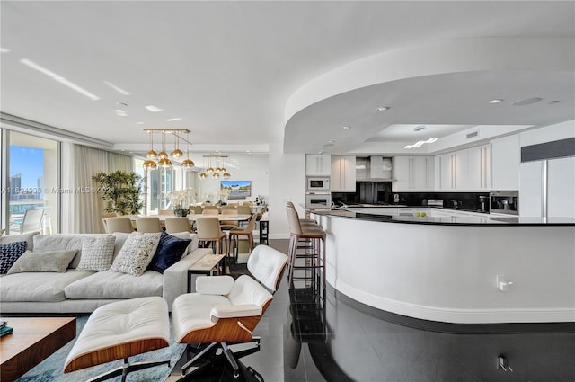 living room featuring a notable chandelier