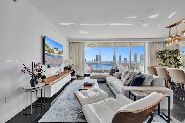 living room with hardwood / wood-style floors and a wall of windows