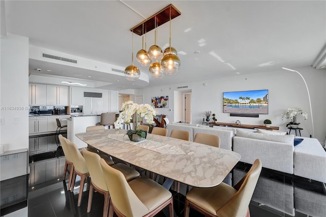 dining space with tile patterned flooring and visible vents